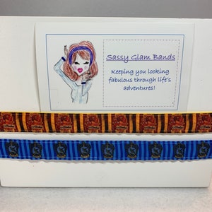 Wizard house crest on either red and golden yellow striped or blue striped grosgrain 7/8&quot; width headband