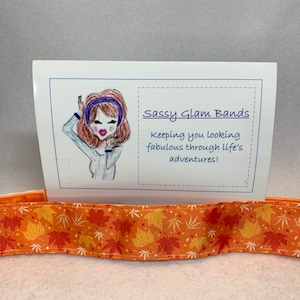 Leaves in a variety of different shapes and colors on orange grosgrain 1.5&quot; width headband