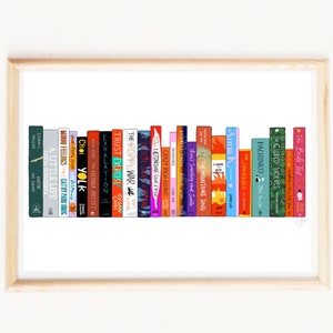 May include: A white background with a bookshelf full of colorful books. The titles of the books are visible, including "The Poppy War", "Trust Exercise", "Crazy Rich Asians", "The Mountains Sing", "Pachinko", and "The Brule Test".