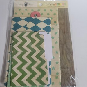 May include: A set of Fancy Pants Everyday Circus patterned envelopes and folders in a clear plastic sleeve. The collection includes items with green chevron, blue diamond, and green star patterns, alongside a vertical brown wood grain design.