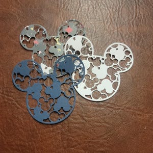 May include: A handmade wooden sign with the text "Welcome" in a playful font. The sign is painted white with a distressed finish, and features a small, decorative heart. Perfect for a front door or entryway.