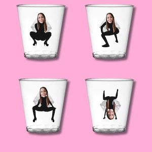 May include: Four clear plastic shot glasses with a bride-to-be's face printed on each. The bride-to-be's face is superimposed on a silhouette of a woman in a wedding dress in different poses.