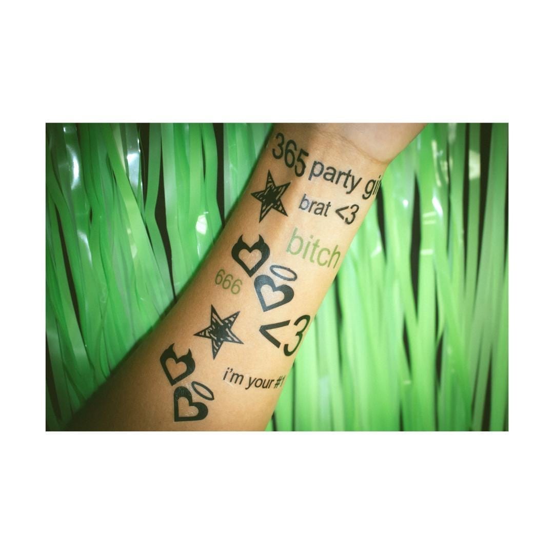 Charli XCX’s Lower Back Tattoo Revealed