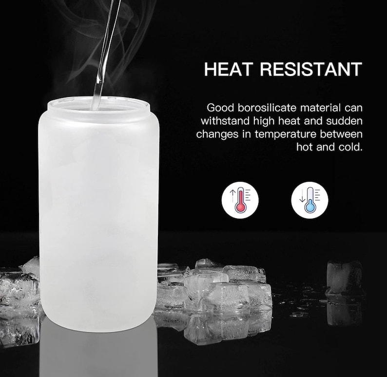 May include: A frosted glass bottle with a wide mouth, designed to withstand high temperatures. The bottle is shown with steam rising from it, and ice cubes are in the background. The text "HEAT RESISTANT" is displayed above the bottle, along with a description of the bottle's heat-resistant properties.