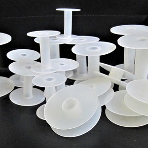 Carretes de plástico blanco, bobina de hilo de alambre vacía para cuerda artesanal, rollos de cadena para cinta, cordón de cuero, vendido por pieza
