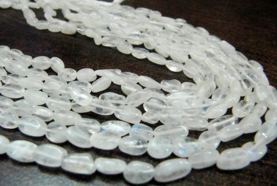 Natural White Rainbow Moonstone Oval Plain smooth Beads 6 to 8mm Strand 13 inches long Best Quality Blue Flashy Beads Wholesale Prices