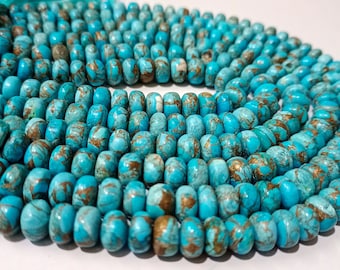 May include: A strand of turquoise blue beads with gold flecks. The beads are round and have a smooth, polished finish.
