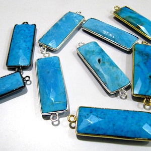May include: A collection of turquoise gemstone connector pieces with gold and silver metal accents. The pieces are rectangular in shape and have a faceted finish.