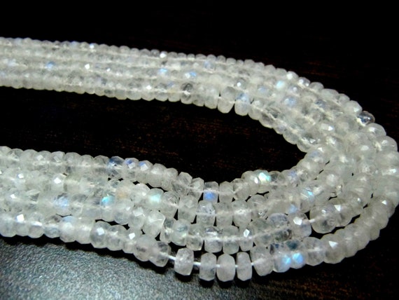 Natural white Rainbow Moonstone Rondelle Faceted 4to7mm Graduated Beads Strand 8 inches long High Quality Blue Flashy Beads Wholesale Prices
