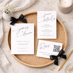 May include: A stylish wedding invitation suite featuring calligraphy. The set includes invitation, details, and RSVP cards, arranged on a woven tray with black satin bows. The invitation reads "James + Laura" and "Please Join Us".