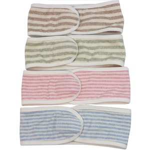 May include: Four striped headbands in different colors: brown and white, green and white, pink and white, and blue and white.
