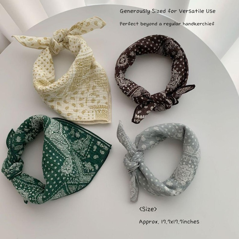 May include: Four square bandanas featuring paisley patterns in cream, dark brown, forest green, and light gray. Each piece is tied into a loop. Text reads: Generously Sized for Versatile Use, Perfect beyond a regular handkerchief, <Size>, Approx. 17.7x17.7inches.