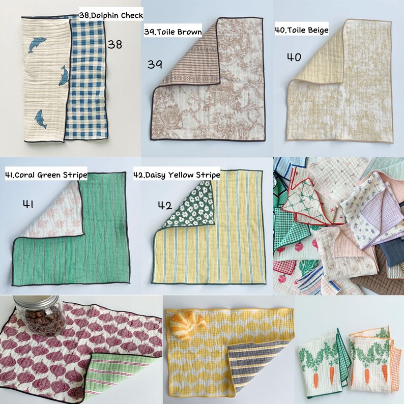 May include: A collection of rectangular fabric cloths featuring various patterns including dolphin prints, toile designs, stripes, floral motifs, and vegetable illustrations like radishes and carrots, displayed in multiple folded arrangements.
