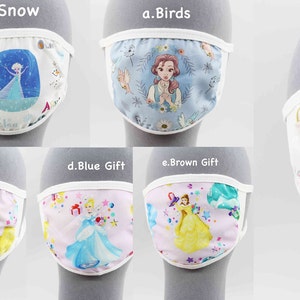 May include: Ten different face masks with various Disney princess characters. The masks are white with a white elastic band. The characters include Elsa, Belle, Rapunzel, Cinderella, and Ariel.