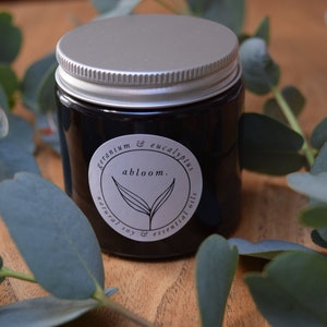 Geranium & Eucalyptus, naturally scented vegan soy wax candle, 100% pure essential oils. Amber glass jar aluminium lid.