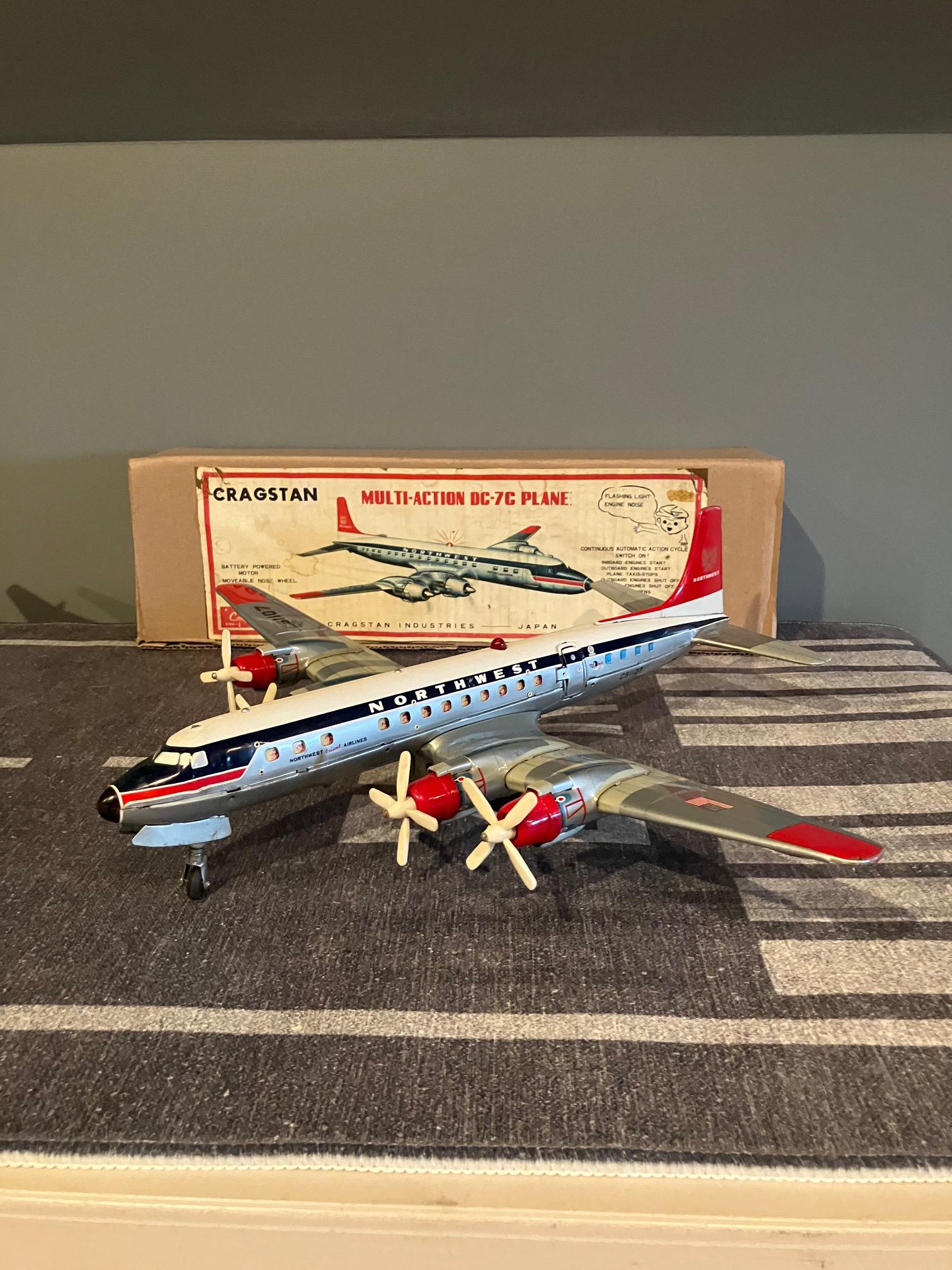 NORTHWEST飛行機模型 Battery Operated Northwest Airlines DC-7 Multi-action Tin