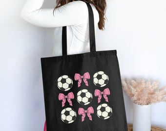 Stijlvolle draagtas met roze strikken en voetbalballenpatroon, perfect voor sportliefhebbers