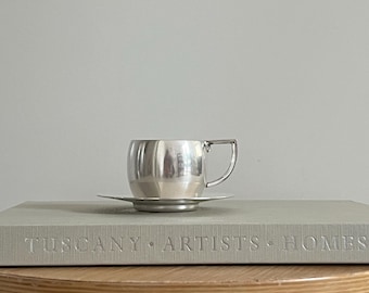 Taza y platillo antiguos de Hollandia Plate, bañados en plata, de la década de 1920 / Diseño holandés antiguo