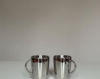 Juego de 2 tazas vintage de acero inoxidable HEMA de los años 80 / Diseño minimalista holandés