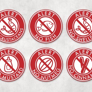 May include: Six red round buttons with white text and images. The buttons say "Alert" and have a diagonal line through an image. The images are a shrimp, a fish, a clam, a bottle of mustard, a nutmeg, and a cinnamon stick.