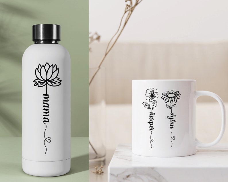 May include: White water bottle with a black lotus flower and the word "mama" written vertically.  White mug with two black flowers and the names "dylan" and "harper" written vertically.