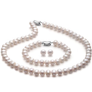 May include: A white pearl necklace, bracelet and earrings set. The necklace and bracelet are made of round pearls and have silver clasps. The earrings are small and round.