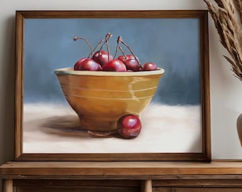 May include: A framed oil painting depicting a yellow ceramic bowl filled with dark red cherries against a muted blue background. One single cherry rests on the surface in front of the bowl, while several others are piled inside the vessel.