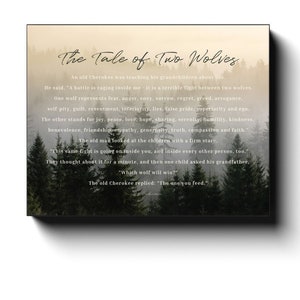 May include: A framed print featuring the text "The Tale of Two Wolves" set against a misty forest backdrop. The text details a Cherokee lesson on inner struggles, listing contrasting characteristics. The print is in a black frame.