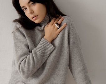 Women mock neck pullover from soft wool. Winterwear for her. Part of skirt suit set.