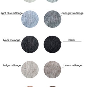 May include: A collection of yarn samples in various colors, including natural white, light gray m&eacute;lange, light blue m&eacute;lange, dark gray m&eacute;lange, black m&eacute;lange, black, beige m&eacute;lange, brown m&eacute;lange, cameo brown, and golden brown.