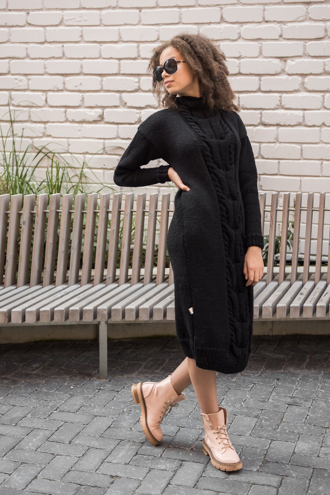 Chunky knit long women sweater dress with a big Cable in front of it, oversized Cable knit long sweater dress