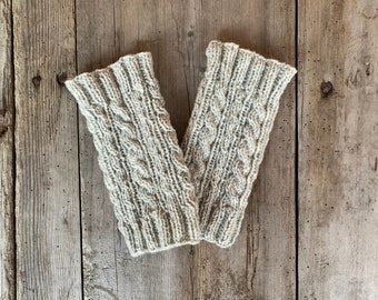 Leg warmers, arm warmers hand-knitted from pure wool with a cable pattern. Wrist warmers, fingerless gloves, hand warmers. Grey-white.