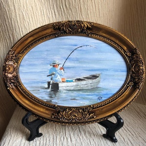 Pintura a óleo de pesca emoldurada: Pescador em barco, moldura dourada rústica