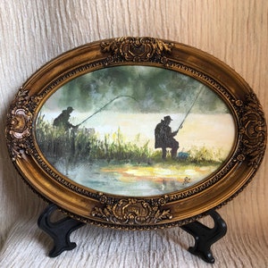 Pintura a óleo sobre pesca ao nascer do sol: pequena arte emoldurada oval em um lago
