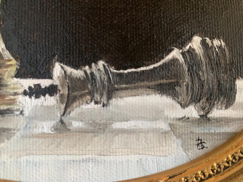 May include: An oil painting on canvas depicting a fallen silver chess king piece lying horizontally on a checkered surface. The background is a solid dark black, and the piece features visible brushstrokes in shades of silver, gray, and white.