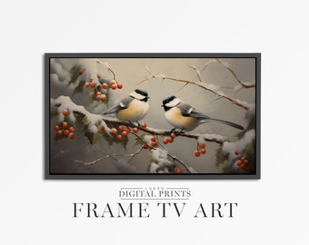 May include: Two black-capped chickadees perched on a snow-covered branch with red berries. The birds are facing each other and have a soft, gray background.