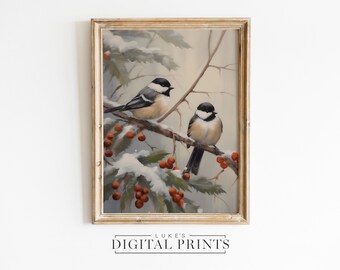 May include: A framed painting of two black-capped chickadees perched on a snow-covered branch with red berries. The background is a soft, muted blue with hints of green.