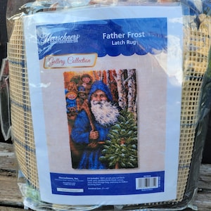 May include: A latch hook rug kit featuring a winter scene with Father Frost carrying a Christmas tree. The kit includes 100% acrylic pre-cut latch hook yarn, a gridded latch hook canvas, a latch hook tool, a storage bag, and easy-to-follow instructions. Finished size: 17 x 40 inches.