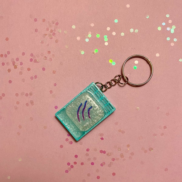 Teal histology cassette keychain with tissue graphic