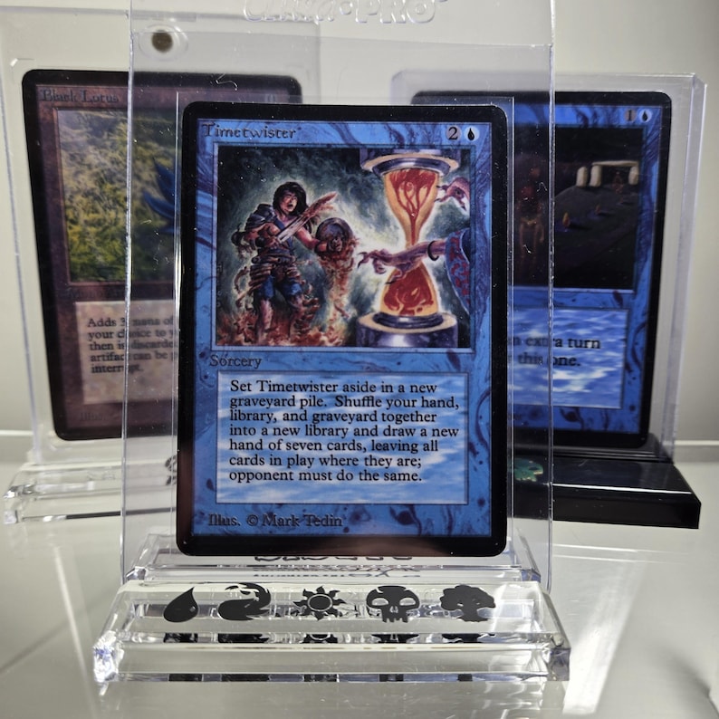 May include: A blue and white Magic: The Gathering card with the text "Timetwister" and the text "Set Timetwister aside in a new graveyard pile. Shuffle your hand, library, and graveyard together into a new library and draw a new hand of seven cards, leaving all cards in play where they are; opponent must do the same."