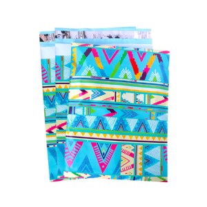 May include: Three blue and white patterned mailing envelopes with colorful geometric designs. The envelopes are stacked on top of each other.
