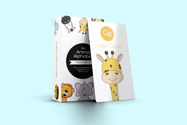 May include: A set of 26 alphabet flashcards featuring colorful illustrations of animals. The card shown is yellow and white and features a cartoon giraffe with the text "Gg is for Giraffe".
