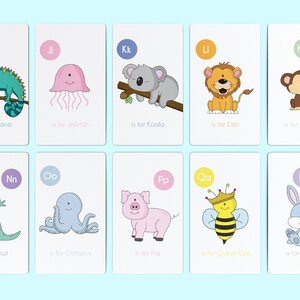 May include: A set of 10 alphabet flashcards featuring colorful illustrations of animals and the letter they represent. Each card has a different animal, such as an iguana, jellyfish, koala, lion, monkey, newt, octopus, pig, queen bee, and rabbit. The cards are designed for children learning the alphabet.