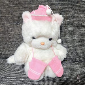 Vintage stuffed white kitty cat black eye