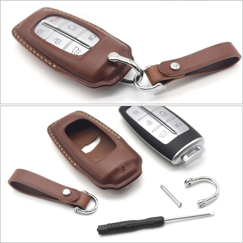 May include: A brown leather key fob with a silver key chain and a silver key. The key fob has a stitched design and a small pocket for the key. The key has a silver button with a car icon on it.