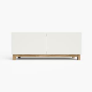 May include: White cabinet with two doors and a wood base. The cabinet is sitting on a white surface.