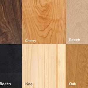 May include: Close-up of six different wood samples: walnut, cherry, beech, ebenholz beech, pine, and oak. Each sample is labeled with its wood type.