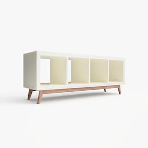 May include: White bookshelf with four open shelves and a wooden base. The bookshelf has a modern design with a simple, clean look.