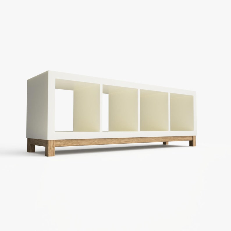 May include: White bookshelf with four open shelves and a wooden base. The shelves are empty.