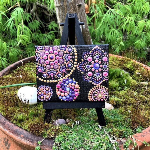 Mini mandala dot art. Unusual hand painted miniature canvas. Black display easel included. Unique home accent or sacred space decoration.